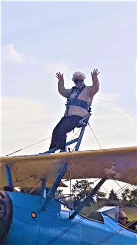 A dare devil pensioner has completed a courageous charity wing walk to raise awareness and help reduce the stigma of dementia.